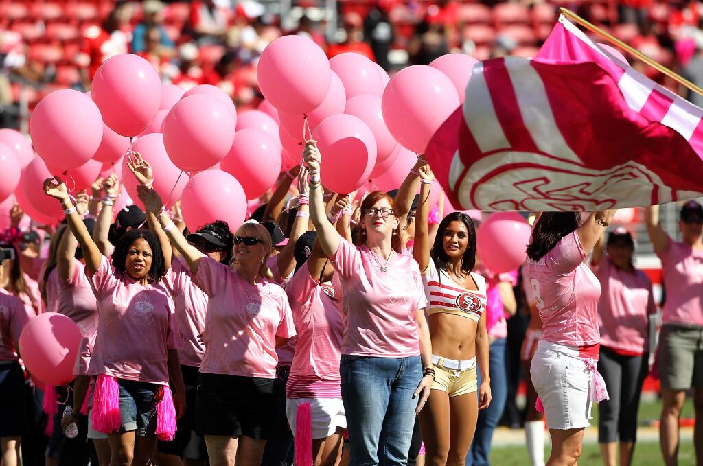 Breast cancer survivors were honored during half time of the 49ers-Chiefs game in support of Breast Cancer Awareness Month. Photo by John Burgess/The Press Democrat