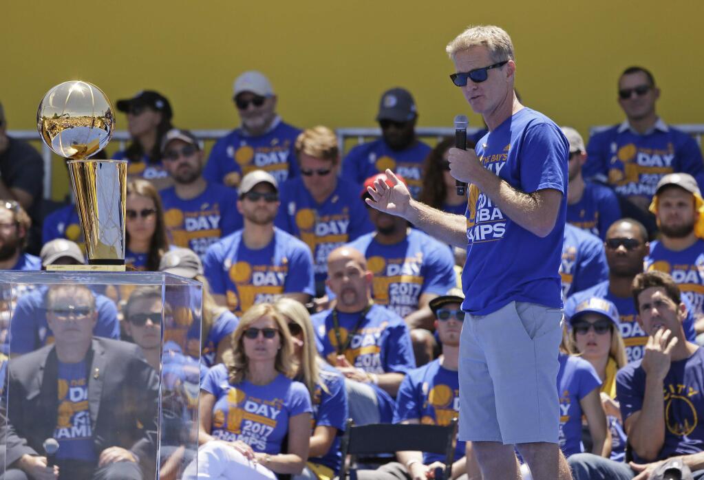 Golden State Warriors coach Steve Kerr speaks during the NBA basketball team's championship rally Thursday, June 15, 2017, in Oakland, Calif. Oakland is celebrating its second championship in the past three years. (AP Photo/Eric Risberg)