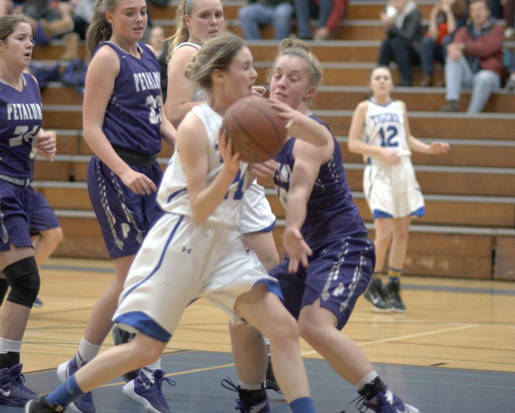RICH LANGDON/FOR THE ARGUS-COURIERPetaluma had a tough time defending Analy's bigger Tigers in a 50-26 loss Tuesdday night.