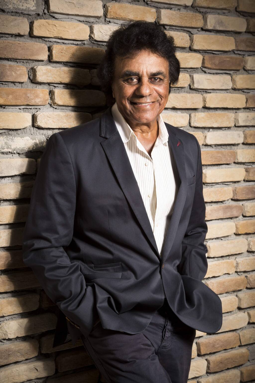 In this Monday, Sept. 8, 2014 photo, singer Johnny Mathis poses for a portrait in Los Angeles. (Photo by Omar Vega/Invision/AP)