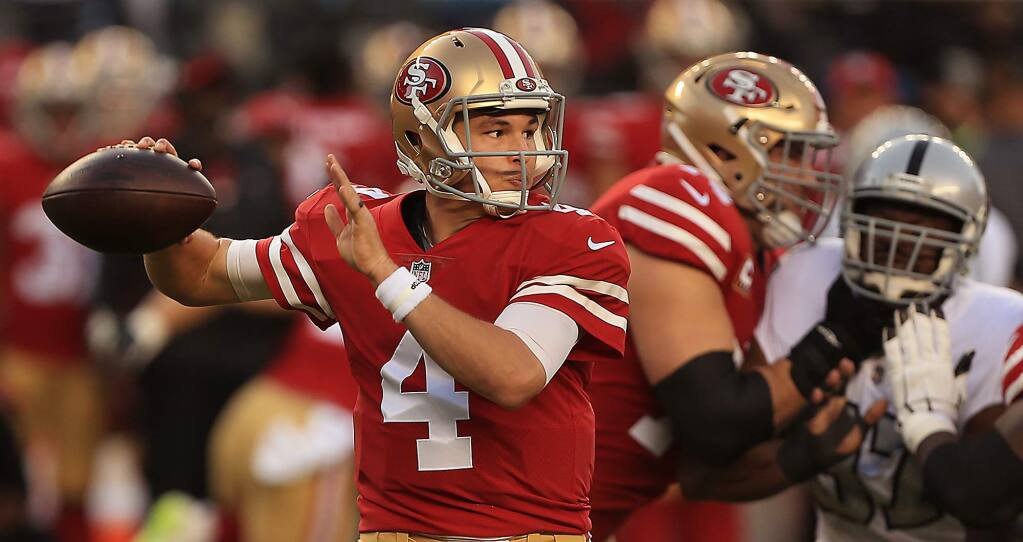 During his first start as quarterback, Nick Mullens throws his first pass for a completion during the 49ers' 34-3 win over the Raiders, Thursday Nov. 1, 2018 in Santa Clara. (Kent Porter / The Press Democrat)