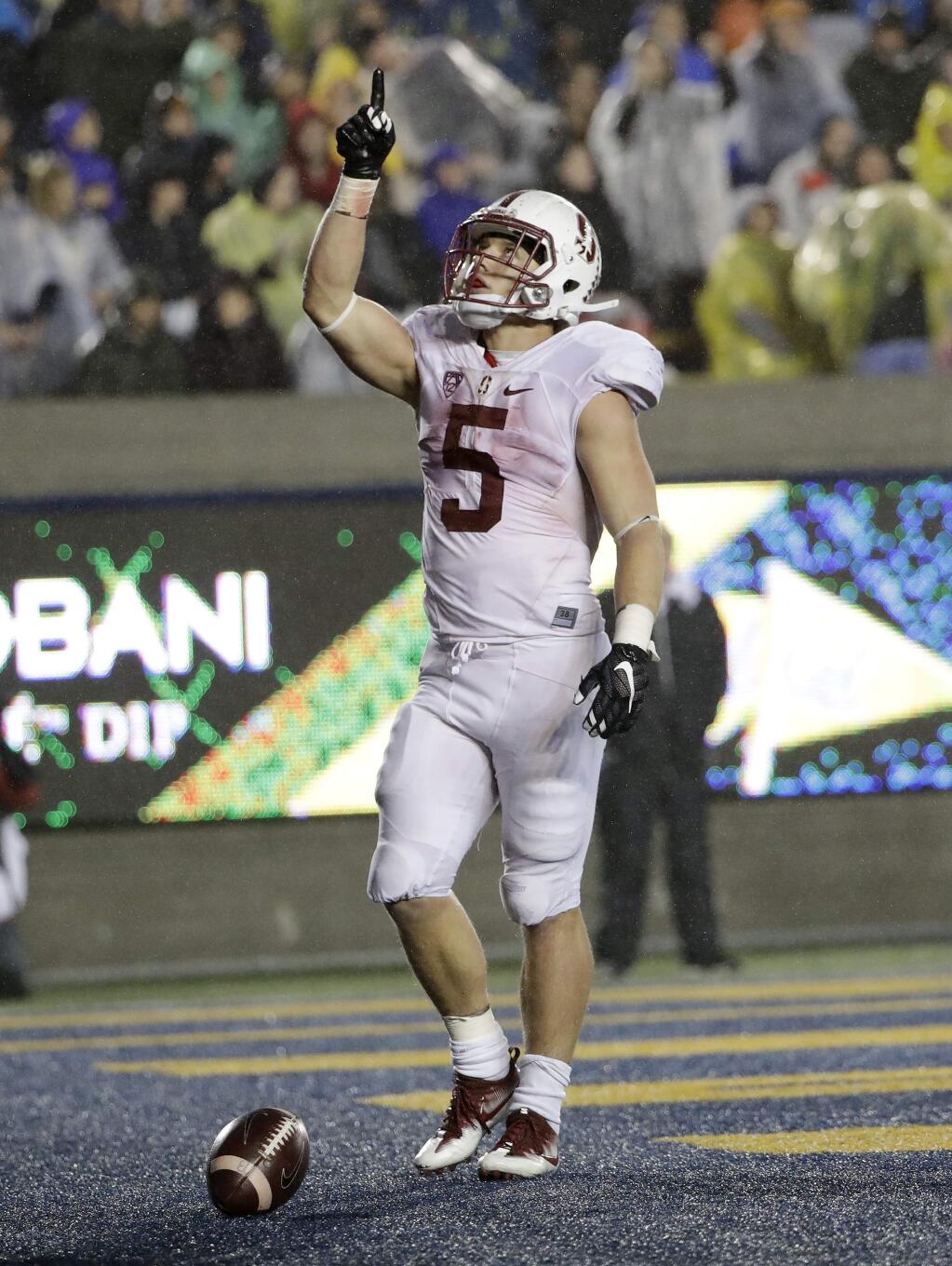 Stanford running back Christian McCaffrey, celebrates after scoring on a 11-yard run against California during the second half of an NCAA college football game Saturday, Nov. 19, 2016, in Berkeley, Calif. Stanford won 45-31. (AP Photo/Marcio Jose Sanchez)