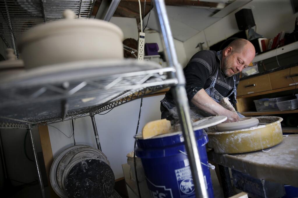 Ceremic artist Gregory Roberts throws a pot for the Sonoma Ash Project in his home studio in Santa Rosa on Wednesday, May 9, 2018. (Beth Schlanker/ The Press Democrat)