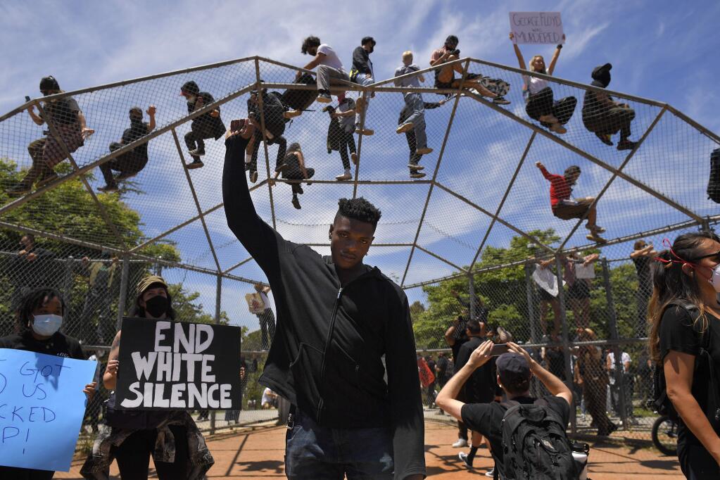 Musical artist Jeleel stands at a protest over the death of George Floyd, Saturday, May 30, 2020, in Los Angeles. Floyd died in police custody on Memorial Day in Minneapolis. (AP Photo/Mark J. Terrill)