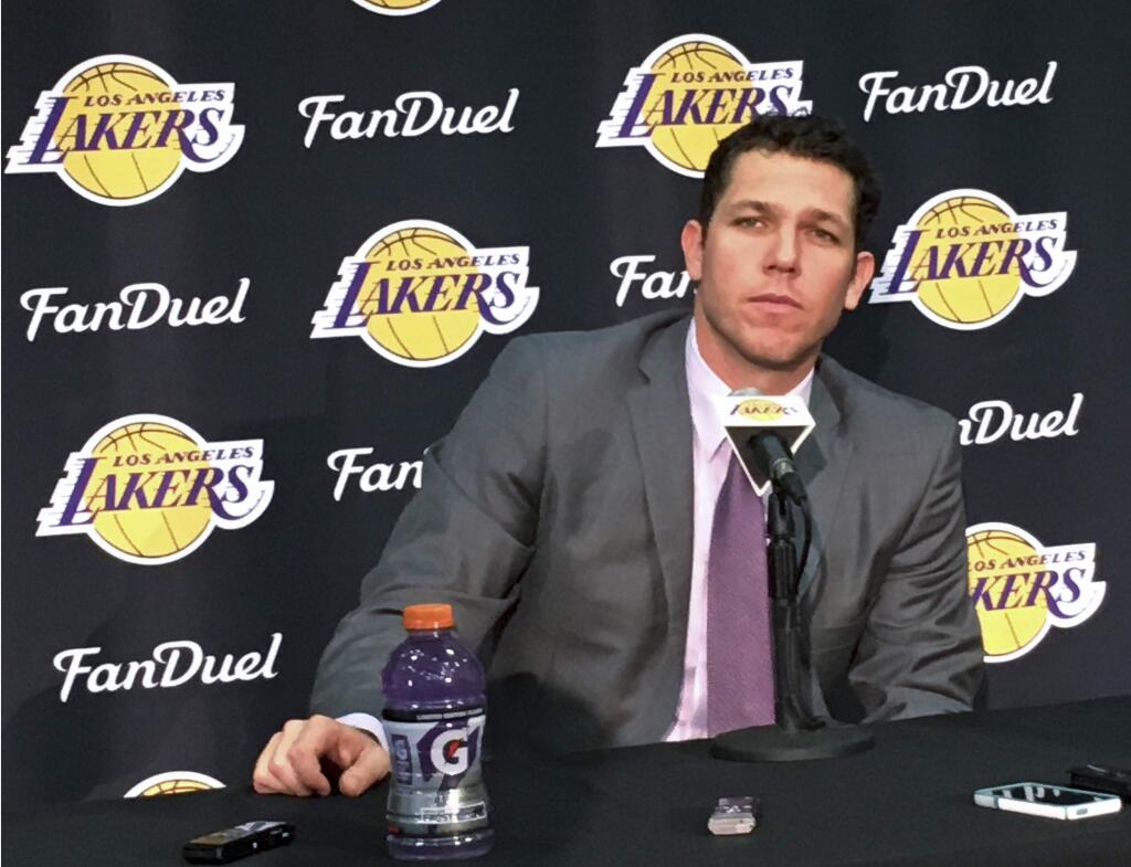 The Los Angeles Lakers' new coach, Luke Walton, takes question during a news conference in El Segundo, Calif., Tuesday, June 21, 2016. Walton knows he's got some catching up to do at his new job. Walton has finally arrived from Golden State, mere days before his downtrodden franchise adds its next big piece in the draft. (AP Photo/Greg Beacham)