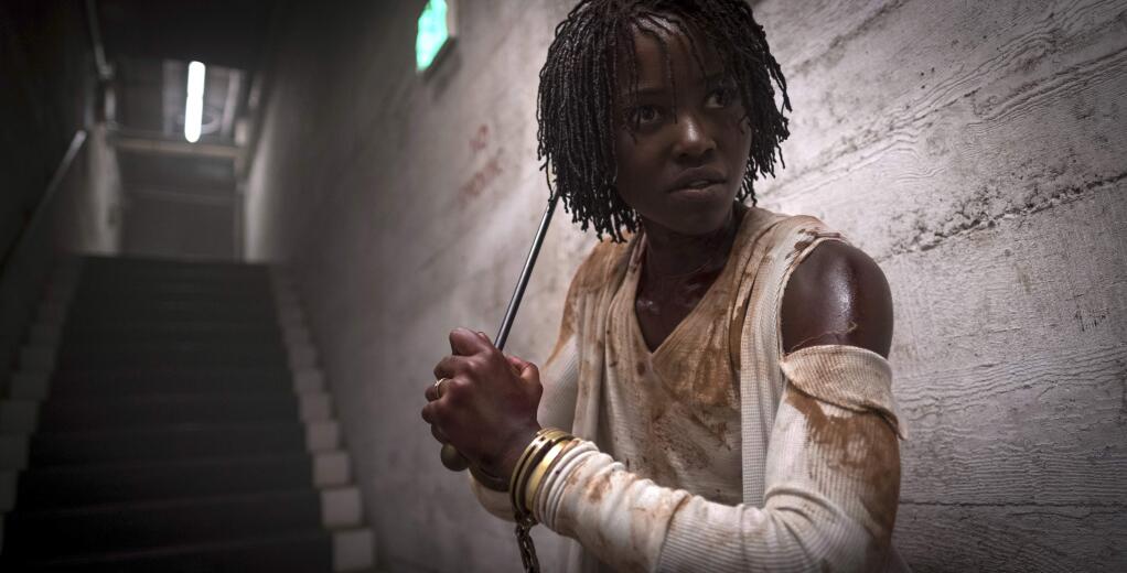 This image released by Universal Pictures shows Lupita Nyong'o in a scene from 'Us,' written, produced and directed by Jordan Peele. (Claudette Barius/Universal Pictures via AP)