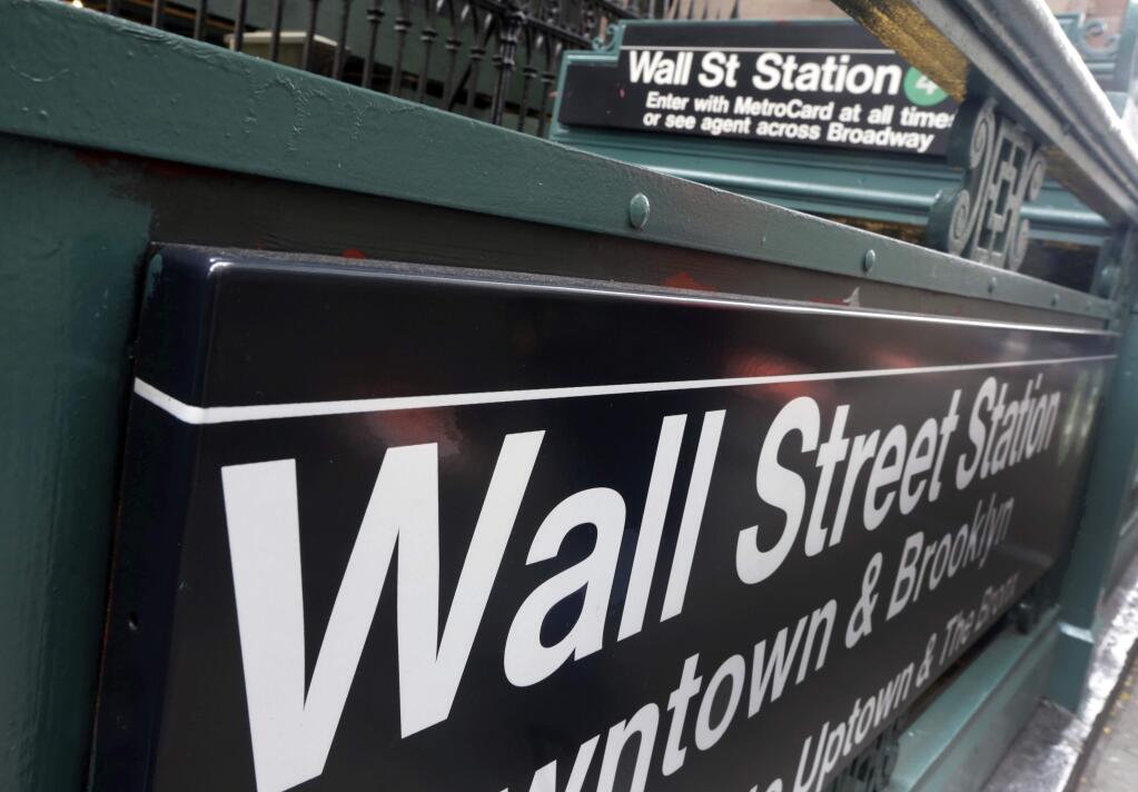 FILE- This Oct. 2, 2014, file photo shows the Wall Street subway stop on Broadway in New York's Financial District. The U.S. stock market opens at 9:30 a.m. EST on Wednesday, Feb. 28, 2018. (AP Photo/Richard Drew)