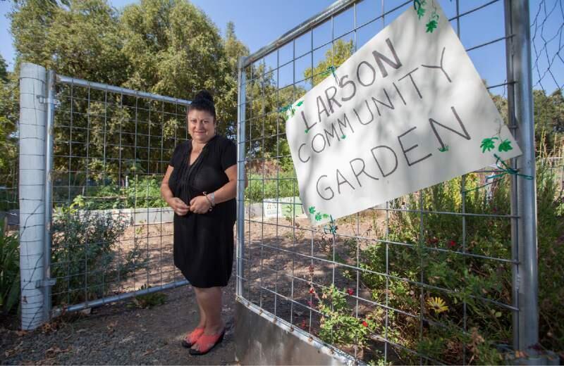 Community garden manager Alejandra Cervantes welcomes the community to Larson park.