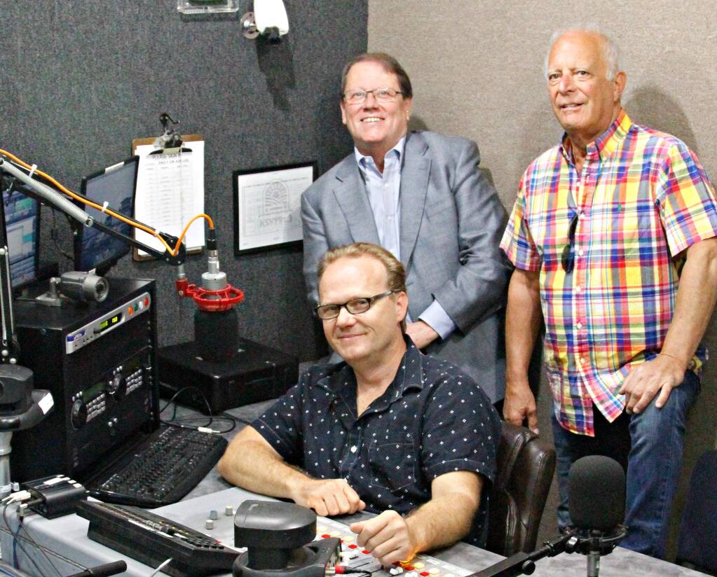 There are 1,000 open radio slots to fill in a given year and Bob Taylor (seated), John Myers and Stan Pappas would like every non-profit in town to take a turn on the air.