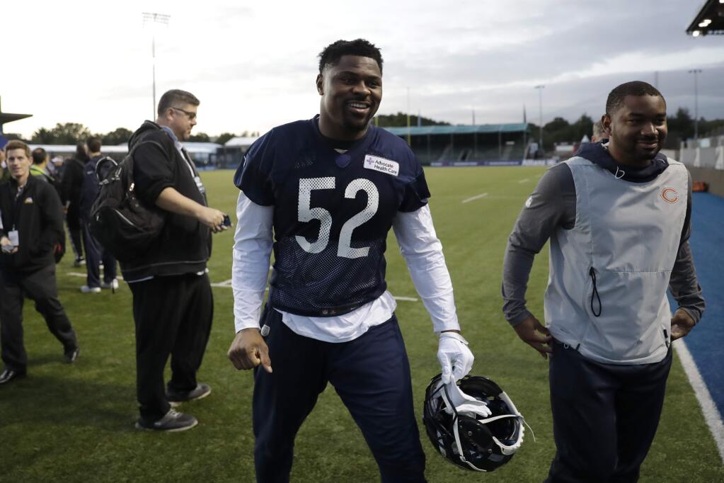 Chicago Bears' outside linebacker Khalil Mack, 52, walks off the field after an NFL training session at the Allianz Park stadium in London, Friday, Oct. 4, 2019. The Chicago Bears are preparing for an NFL regular season game against the Oakland Raiders in London on Sunday. (AP Photo/Matt Dunham)