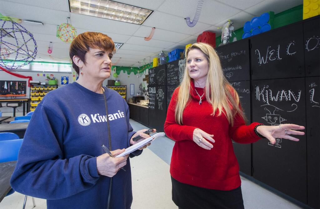 Makerspace teacher Lori Edwards, right, speaks with Kiwanis communications specialist Julie Cope Saetre about the new maker room at Sassarini Elementary School. The Kiwanis significant contribution made this collaborative working environment possible. (Photo by Robbi Pengelly/Index-Tribune)