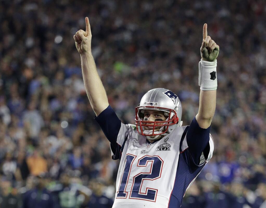 FILE - In this Feb. 1, 2015, file photo, New England Patriots quarterback Tom Brady (12) celebrates during the second half of NFL Super Bowl XLIX football game against the Seattle Seahawks, in Glendale, Ariz. Brady's missing jersey from the Super Bowl has been found in the possession of a member of the international media. The NFL said in a statement Monday, March 20, 2017, that his jersey was found through the 'cooperation of the NFL and New England Patriots' security teams, the FBI and other law enforcement authorities.' Brady said his jersey went missing after the Patriots' 34-28 win last month over the Atlanta Falcons. The statement also said an ongoing investigation retrieved the jersey Brady wore in the Patriots' 2015 Super Bowl win against the Seahawks. (AP Photo/Kathy Willens, File)