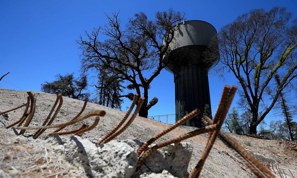The remains of a foundation next to Santa Rosa's R5 water tank on Skyfarm Drive in Santa Rosa's Fountaingrove neighborhood on Tuesday, July 17, 2018. (KENT PORTER/ PD)