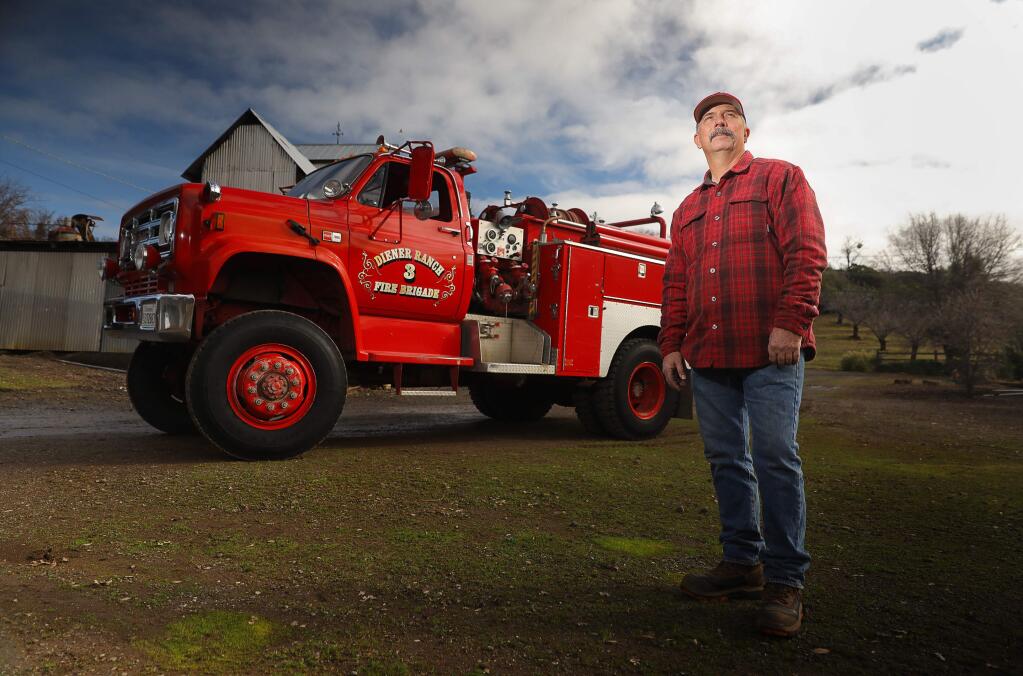 Recently retired Lake County Fire Protection District Battalion Chief and Fire Marshall Charlie Diener is taking a Type-3 fire engine with him to protect his family ranch, and nearby community, near Lower Lake. The Diener Ranch purchased the engine after it was designated surplus. Diener fought many fires over the course of his 38 year career on the engine, which was initially purchased by the fire department in 1987. (Christopher Chung/ The Press Democrat)
