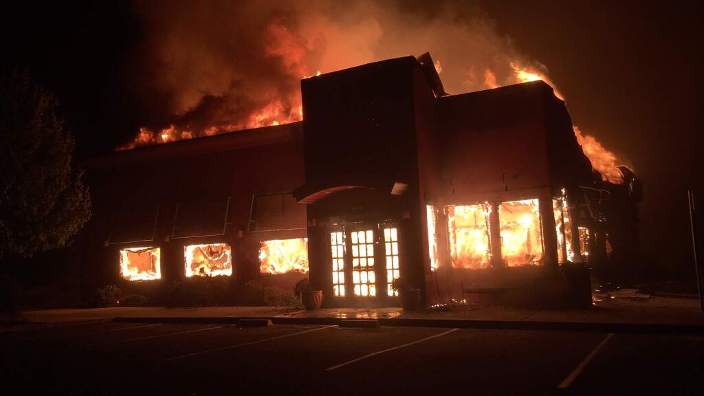 The Applebee's restaurant on Hopper Avenue in Santa Rosa burns early Monday, Oct. 9, 2017. (KENT PORTER/ The Press Democrat)