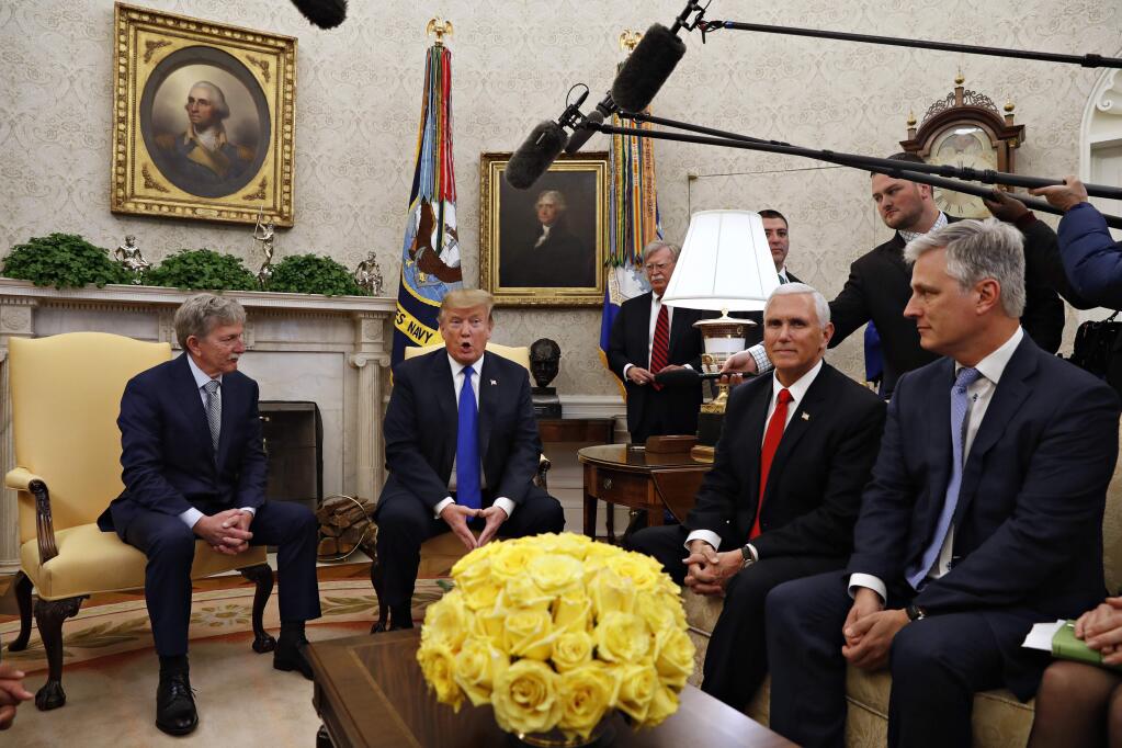 FILE - In this March 6, 2019, file photo, former U.S. hostage in Yemen, Danny Burch, left, listens as President Donald Trump speaks, Wednesday, March 6, 2019, in the Oval Office of the White House in Washington, next to Vice President Mike Pence, and Special Presidential Envoy for Hostage Affairs Robert O'Brien. At back, to the right of Trump, is then-national security adviser John Bolton. President Donald Trump says he plans to name O'Brien to be his new national security adviser. (AP Photo/Jacquelyn Martin, File)