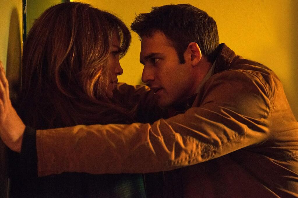 Universal PicturesJennifer Lopez as a teacher and newly divoced woman who is stalked after having an affair with one of her students (Ryan Guzman) in 'The Boy Next Door.'