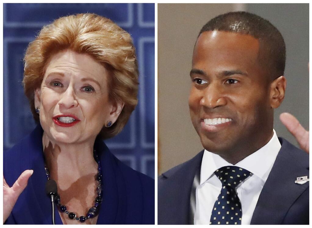 FILE - This combination of Oct. 15, 2018, file photos shows Michigan U.S. Senate candidates in the November 2018 election from left, incumbent Democratic Sen. Debbie Stabenow and Republican John James. (AP Photo/Carlos Osorio, File)
