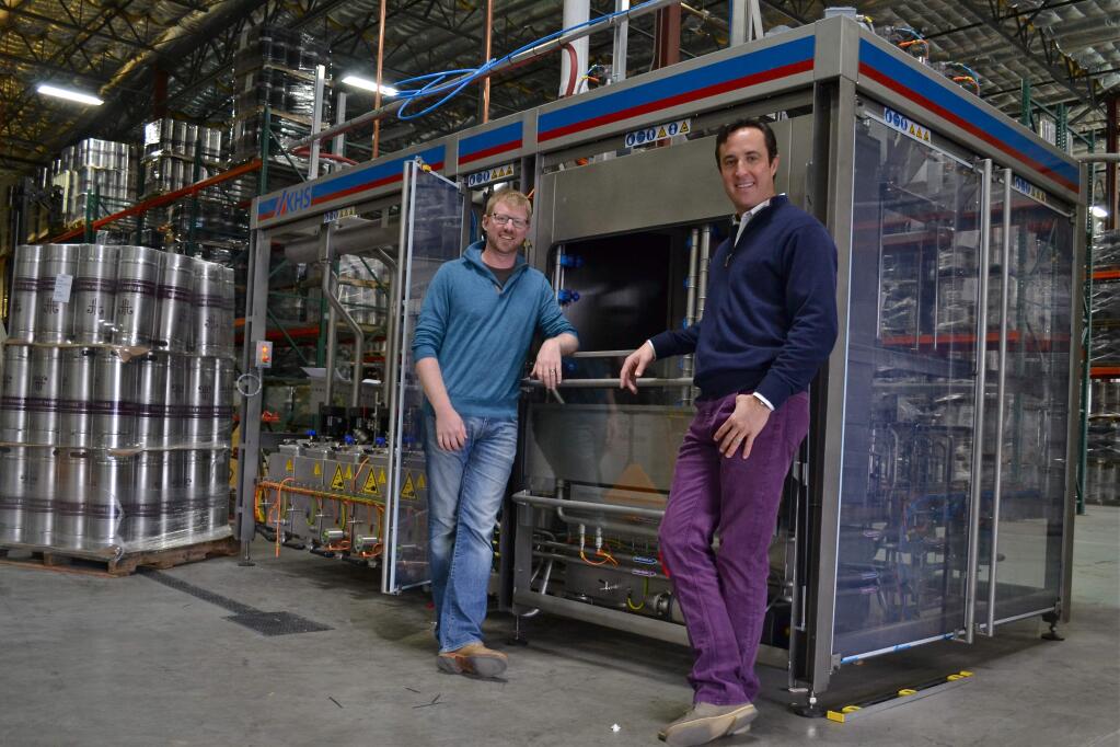 With its automated wine keg cleaner, sterilizer and filler, Free Flow Wines, co-founded by Jordan Kivelstadt (left) and Dan Donahoe, moves thousands of vessels a month in and out of its Napa facility to wine-on-tap venues nationwide. (Free Flow Wines, Oct. 23, 2011)