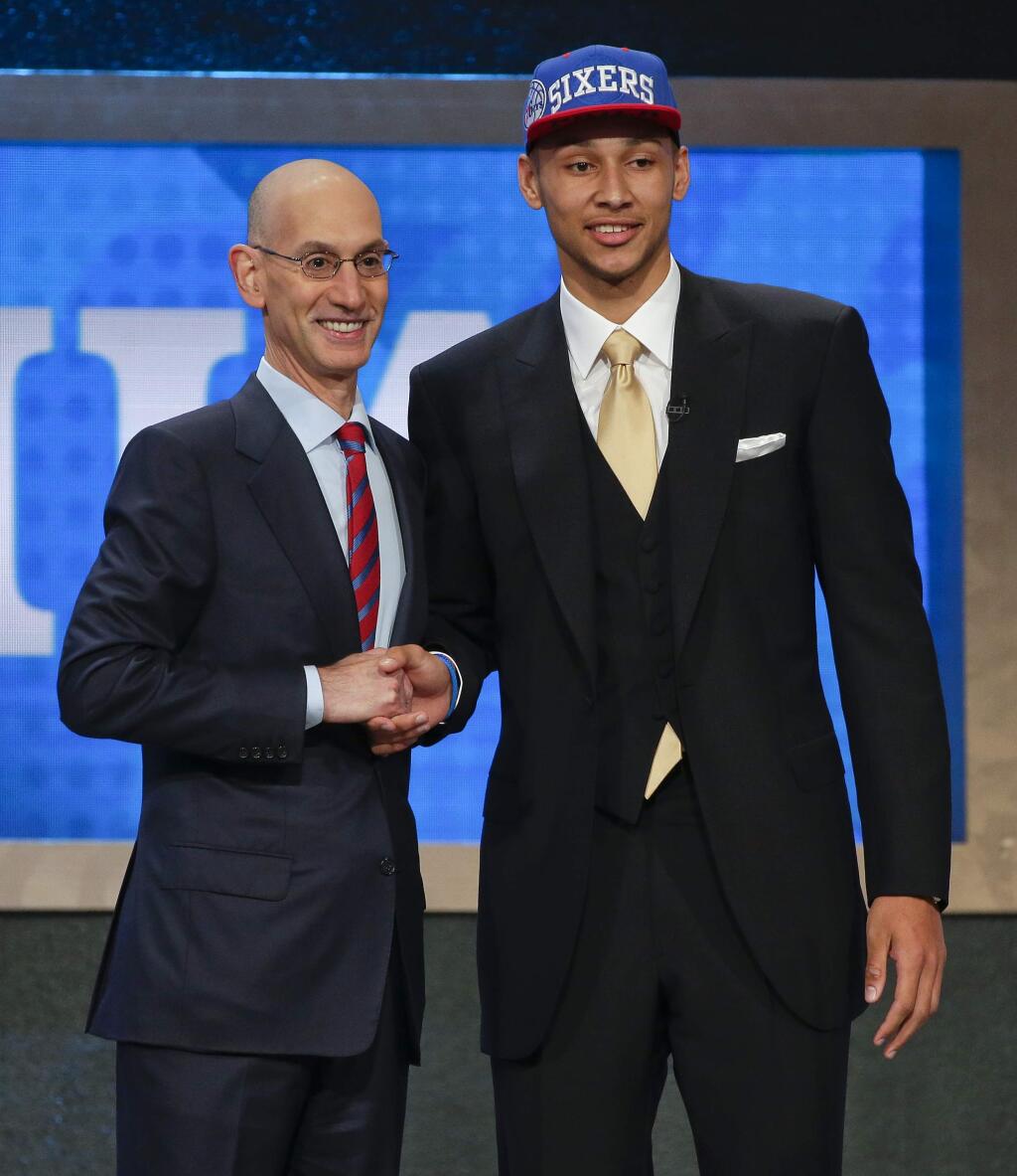 LSU's Ben Simmons poses for a photo with NBA Commissioner Adam Silver after being selected as the top pick by the Philadelphia 76ers during the NBA draft, Thursday, June 23, 2016, in New York. (AP Photo/Frank Franklin II)