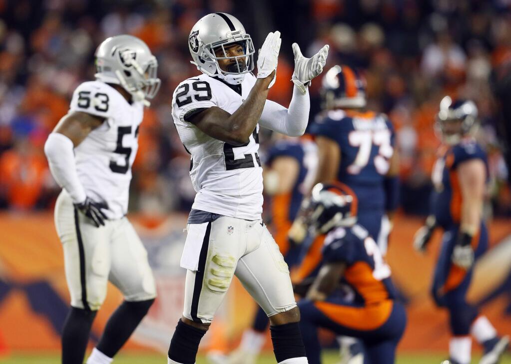 Oakland Raiders cornerback David Amerson (29) celebrates a fourth down stop against the Denver Broncos during the second half of an NFL football game, Sunday, Dec. 13, 2015, in Denver. The Raiders won 15-12. (AP Photo/Joe Mahoney)