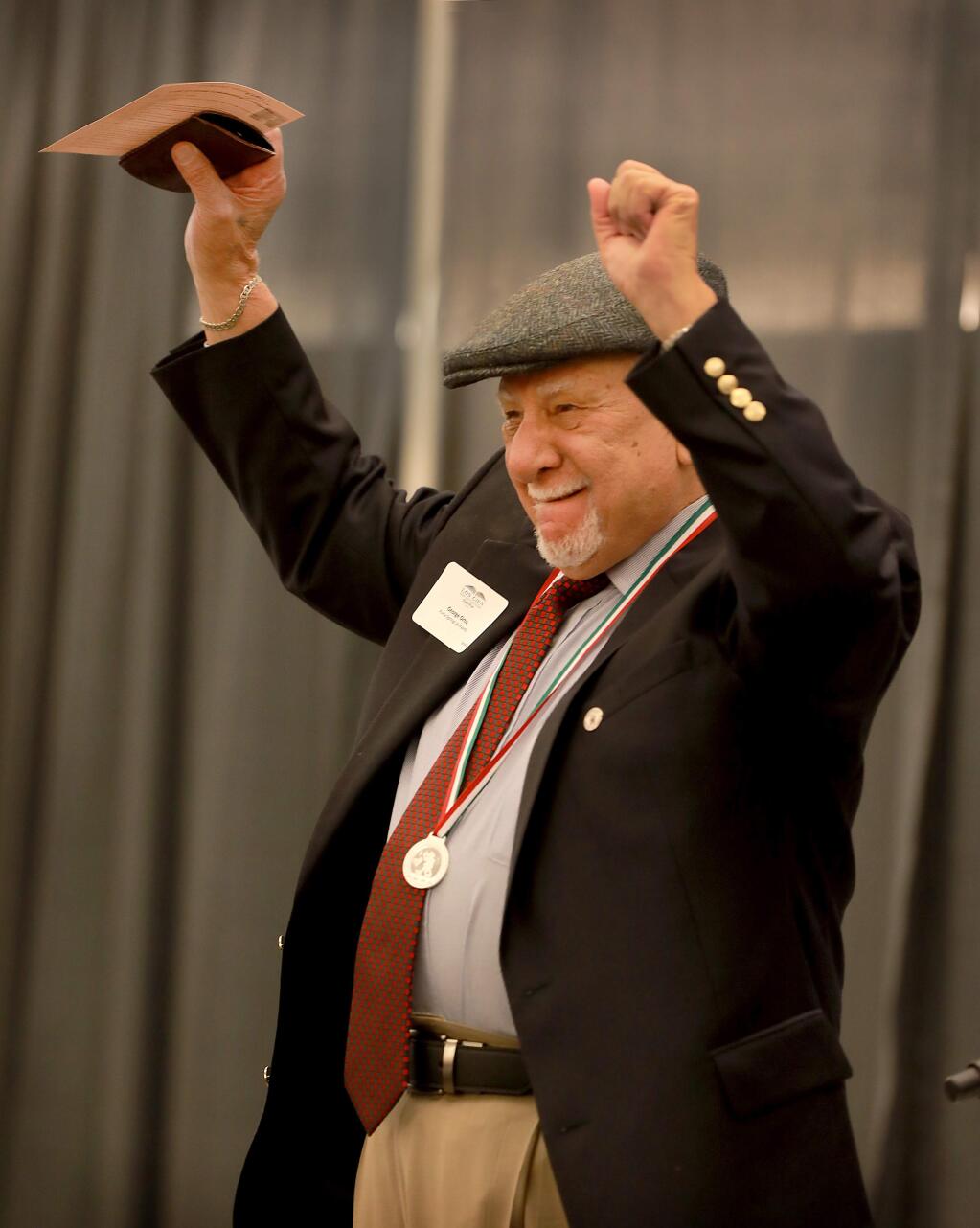 Local farmworker advocate George Ortiz wears the OHTLI Award medal presented to him by Mexico Consul General Gemi Gonzalez Lopez at the 5th annual Los Cien State of the Latino Community forum at Sonoma State University on Thursday. (photo by John Burgess/The Press Democrat)