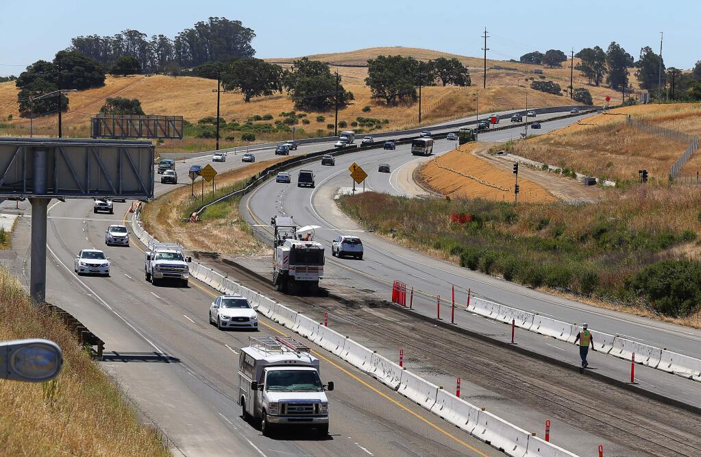 Construction work continues on Highway 101, south of the Petaluma Boulevard South overpass, in Petaluma, on Wednesday, June 22, 2016. (Christopher Chung/ The Press Democrat)