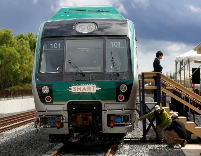 A SMART commuter train pulls into the Cotati train depot during an official unveiling of the train cars on Tuesday, April 7, 2015. (KENT PORTER/ PD FILE)