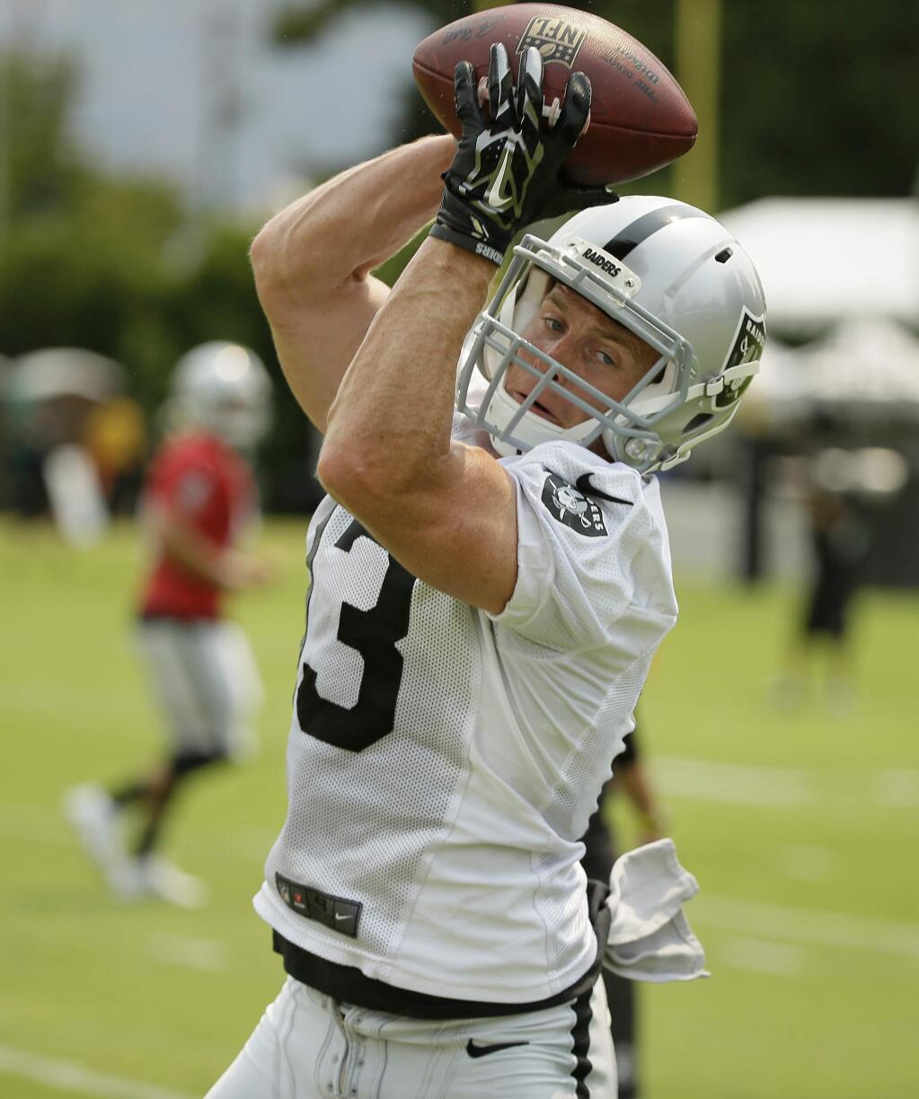 Oakland Raiders wide receiver Austin Willis catches a pass during their football training camp Friday, July 31, 2015, in Napa, Calif. (AP Photo/Eric Risberg)