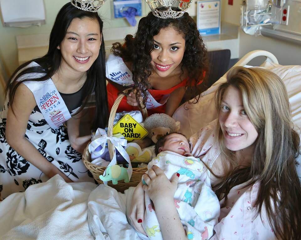 Middletown resident Cherish Johnson, 18, with her newborn at Kaiser Permanente Medical Center in Santa Rosa on Thursday, Jan. 1, 2015.. Miss Sonoma Countys Outstanding Teen Catherine Liang and Miss Sonoma County Skylaer Palacios presented newborn Marshal Jr. and parents Cherish and Marshal with a gift basket full of goodies. (photo by Will Bucquoy)