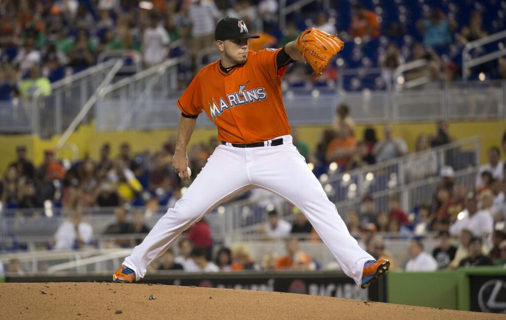 Miami Marlins starting pitcher Jose Fernandez (16) throws to the San Francisco Giants during the first inning of a baseball game in Miami, Thursday, July 2, 2015. (AP Photo/J Pat Carter)