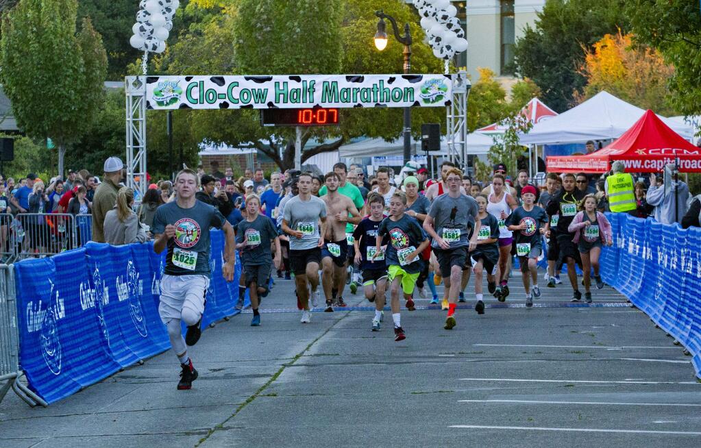 They are off and running at the start of the 5K run, Andy Azevedo was first out at the start of the Clo Cow Half Marathon and 5K run held in downtown Petaluma Sunday. Alex Wolf-Root won the half marathon in 1:17.24. Sarah Hallas was first among the women in 1:26.35.Brandon Day was first in the 5K in 17:43. The first woman 5K finisher was Shannan Salvisberg in 21:30.(JOHN O'HARA/ PHOTOS FOR THE ARGUS-COURIER)