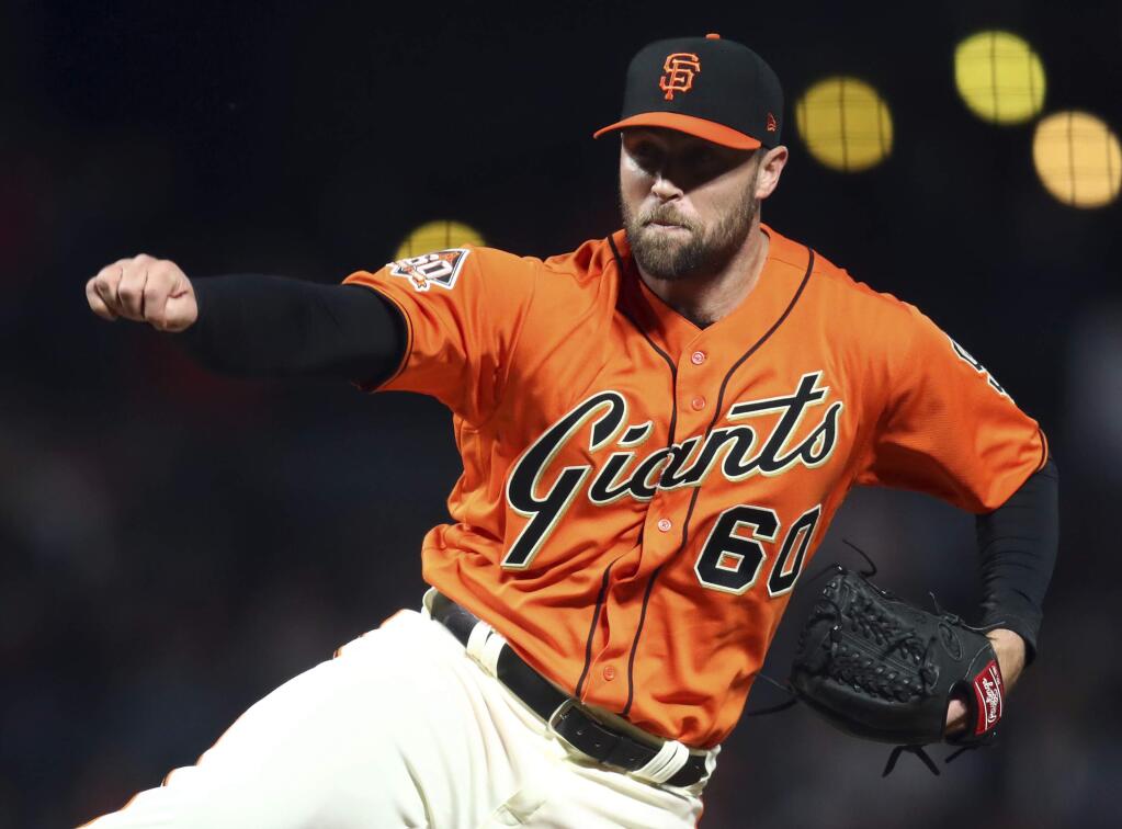 San Francisco Giants pitcher Hunter Strickland follows through on a delivery to a Philadelphia Phillies batter during the ninth inning Friday, June 1, 2018, in San Francisco. (AP Photo/Ben Margot)
