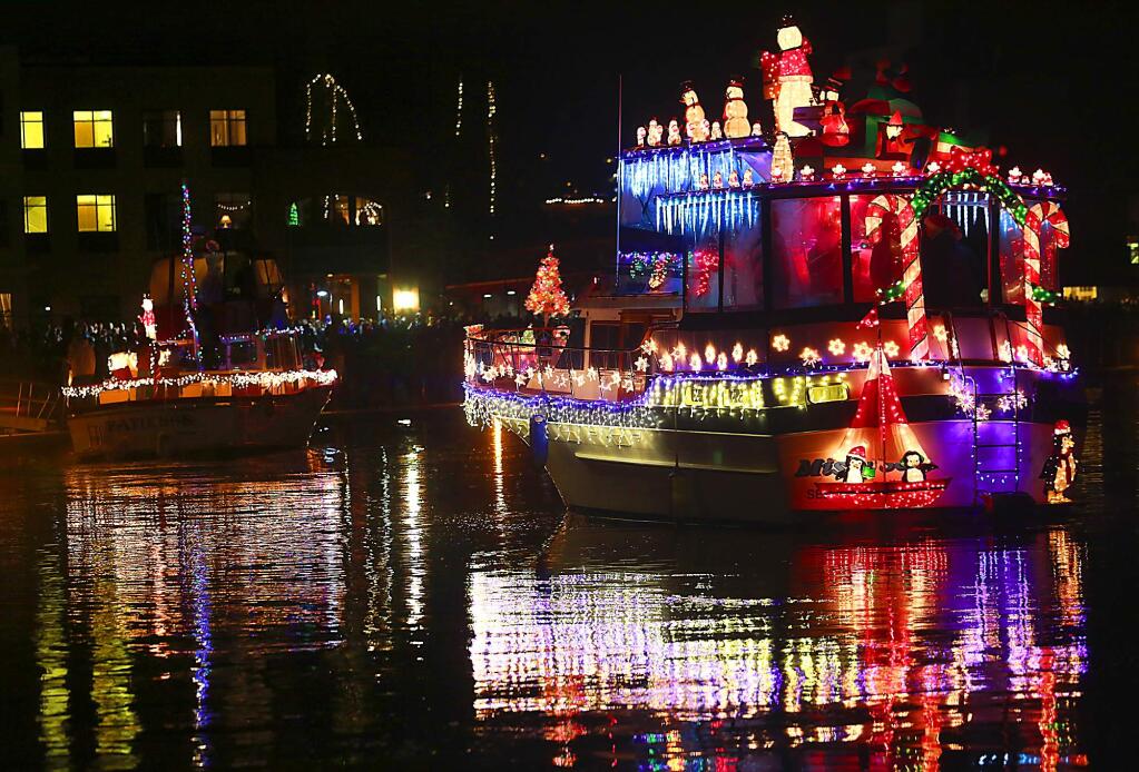 The Petaluma Lighted Boat Parade cruised into the downtown turning basin on Saturday, December 13, 2014. (photo by John Burgess/The Press Democrat)