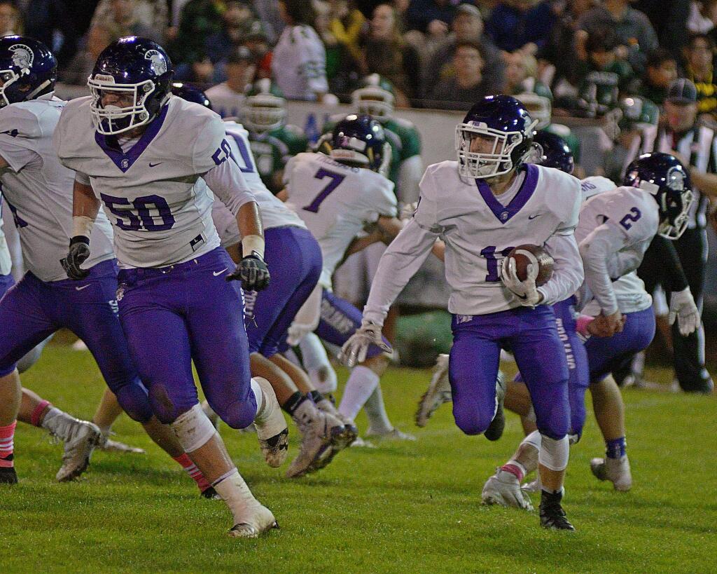 SUMNER FOWLER/FOR THE ARGUS-COURIERDominic Butts (11) hopes to follow Daniel Decarli (50) for big gains against Napa at Steve Ellison Field Friday night.