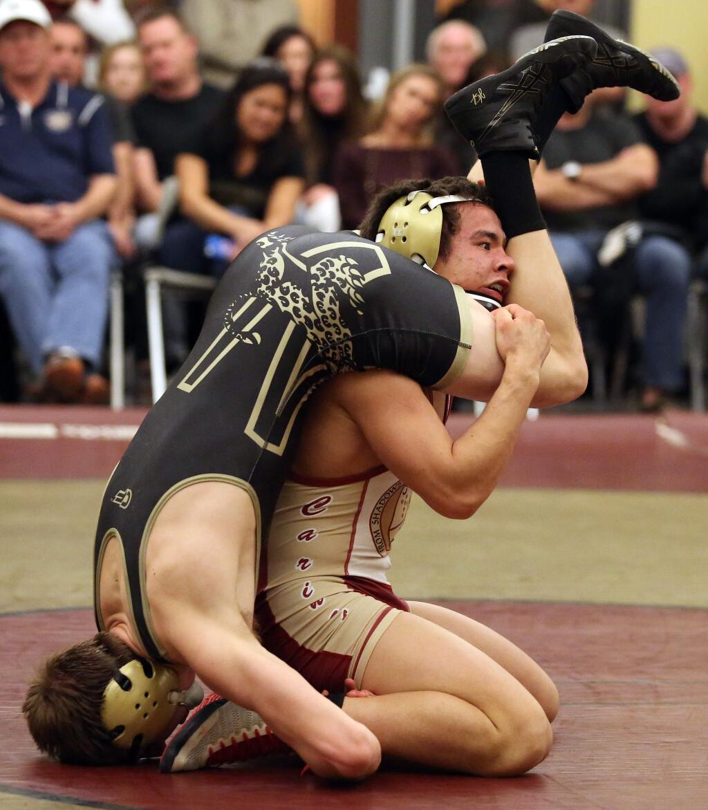 Cardinal Newman's Jake Butler defeated Windsor's Ethan King in the 134 weight class during the match held at Cardinal Newman, Wednesday, January 28, 2015. (Crista Jeremiason / The Press Democrat)