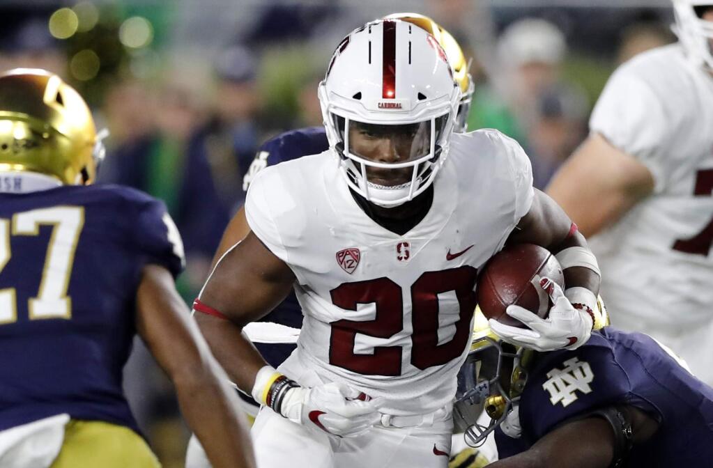 In this Sept. 29, 2018, file photo ,Stanford running back Bryce Love rushes during the first half against Notre Dame in South Bend, Ind. (AP Photo/Carlos Osorio)