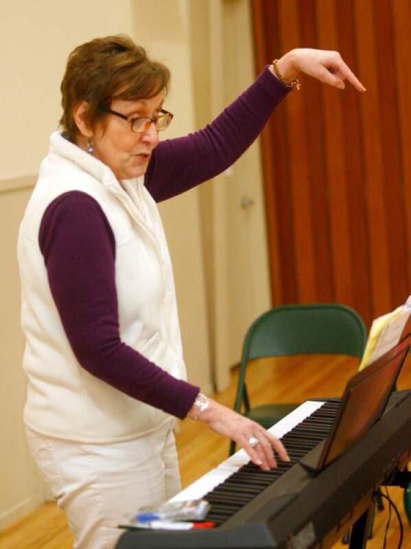 MAKING MUSIC: Linda Manuilow, the new director of The Petaluma Chorale, leads her singers in a vocal warmup.PHOTO COURTESY THE PRESS DEMOCRAT
