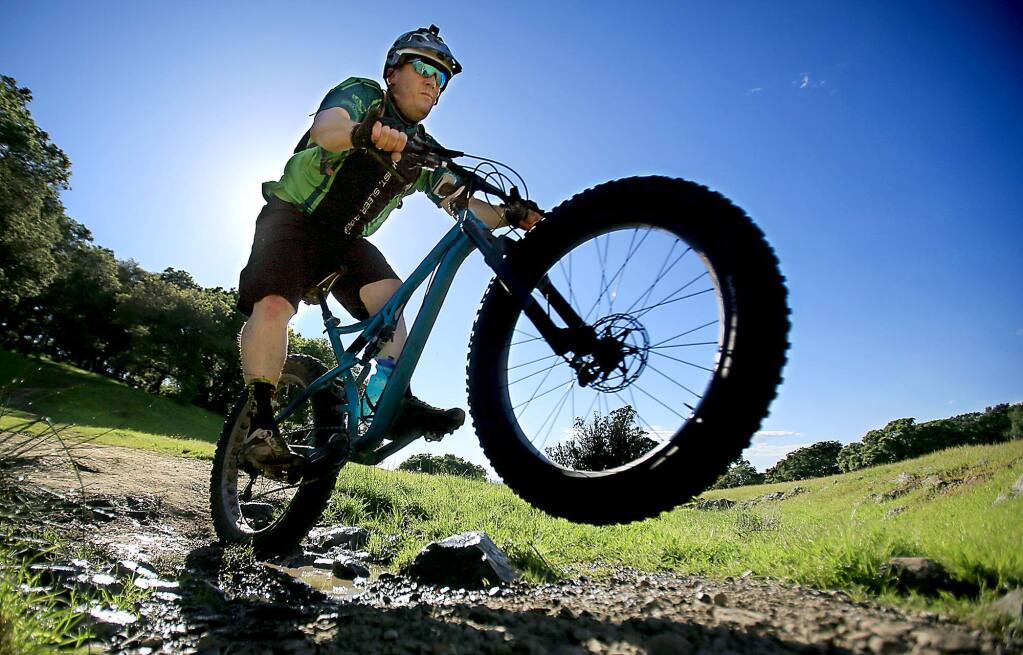 Sebastian Brewer rides his fat tire mountain bike a Taylor Mountain Regional Park and Open Space Preserve in Santa Rosa, Tuesday March 29, 2016. (Kent Porter / Press Democrat) 2016
