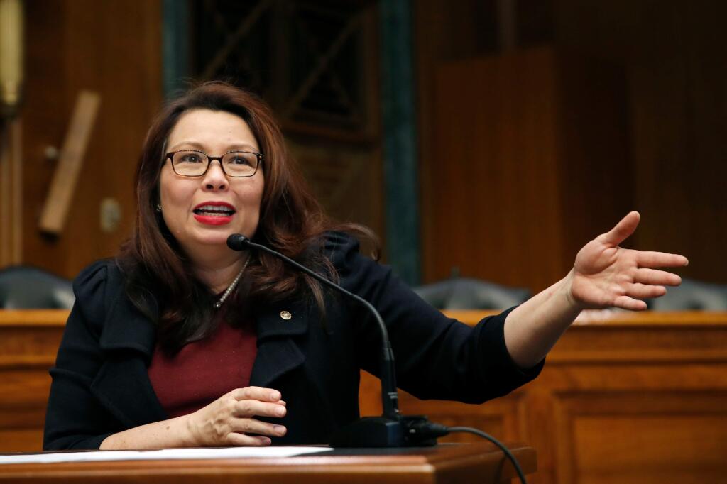 FILE - In this Feb. 14, 2018, photo, Sen. Tammy Duckworth, D-Ill., speaks to Goldman Sachs 10,000 Small Businesses Summit, on Capitol Hill, in Washington. Babies do not care about Senate decorum. But in a bow to working parents, the tradition-bound institution is considering letting the newborns of senators in. The inspiration is Duckworth's daughter, born April 9. Duckworth wants to continue voting, and the Senate requires that votes be cast in person. So she's proposing that babies be allowed into the chamber.(AP Photo/Alex Brandon, File)