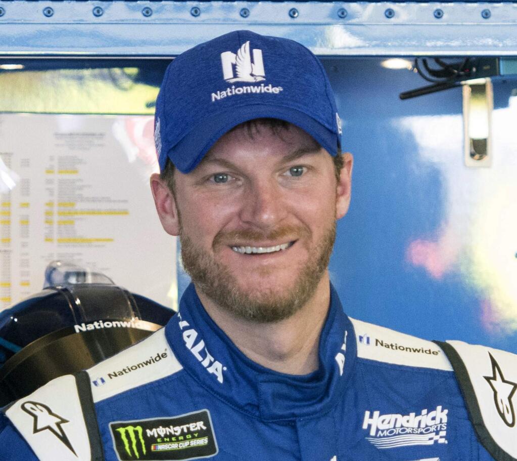 FILE - In this March 3, 2017, file photo, Dale Earnhardt Jr. smiles in the garage during practice for the NASCAR Monster Energy Cup auto race at Atlanta Motor Speedway in Hampton, Ga. Hendrick Motorsports says Dale Earnhardt Jr. will retire at the end of this season. (AP Photo/John Amis, File)