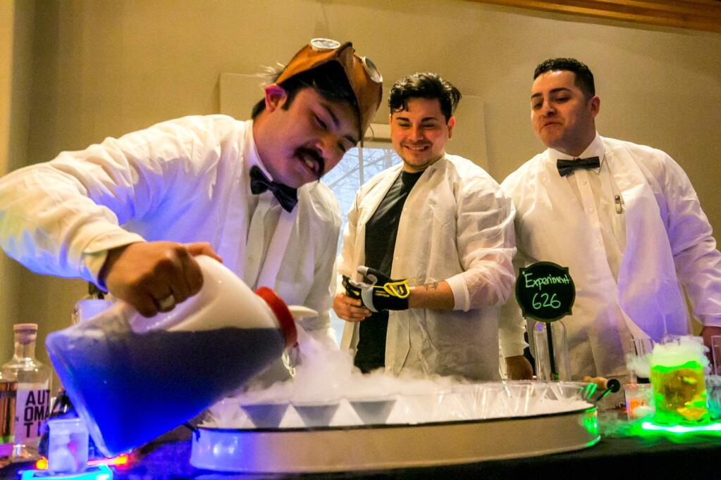 The mad scientists of Tips Roadside -- (from left) Shawn Echeverria, Gerardo Ramirez and Sebastian Juarez--concoct their 'Experiment 360' cocktail at the annual Martini Madness competition at the Lodge at Sonoma Friday, Feb. 1, 2019. (Photo by Julie Vader/special to the Index-Tribune)