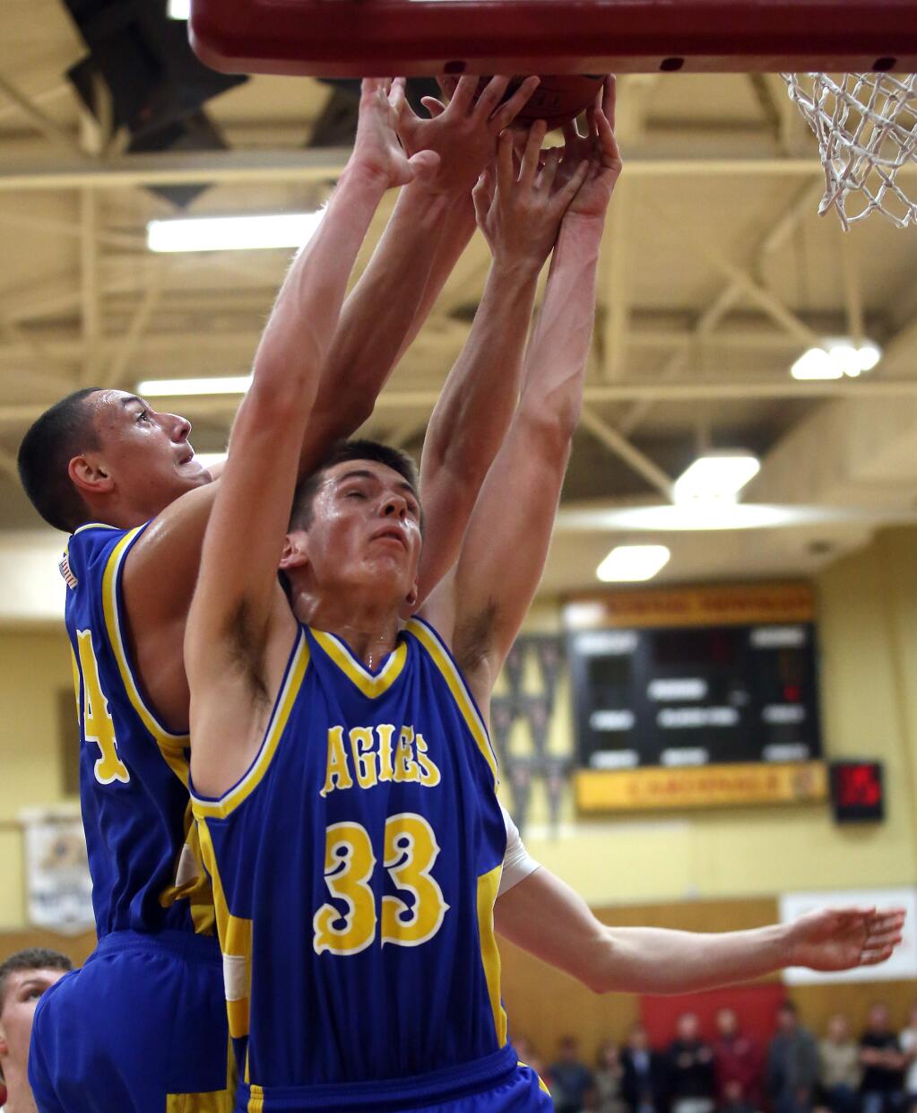 Cloverdale's Jayson McMillan, right, goes up for a rebound during a game in February 2015. McMillan was selected by league coaches as the 2016 NCL I All-League Boys Basketball Most Valuable Player. (Crista Jeremiason / The Press Democrat)
