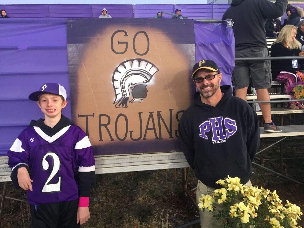 PHOTO FROJ JOBBIE SPILLANEAiden Spillane and father, Brett, have a special father-son bond. They are the Petaluma High School football team's biggest fans. Aiden is also the team waterboy.