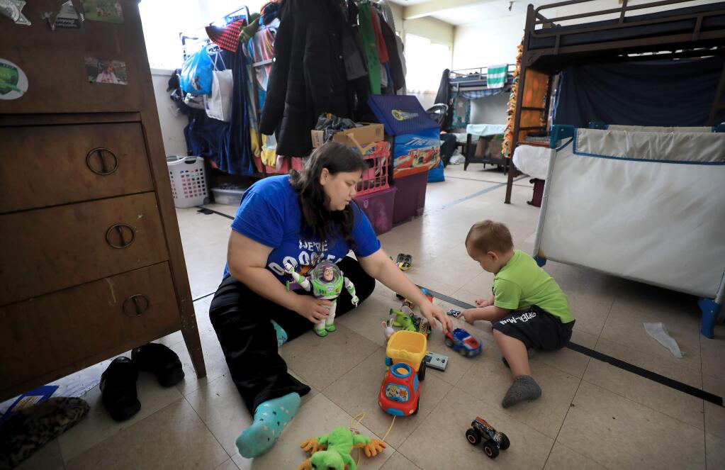 Nathan Isaiah Chadwick, nearly two, plays with her mom Ashley Chadwick, Thursday, April 4, 2019 at Catholic Charities Family Support Center in Santa Rosa, Thursday, April 4, 2019. (Kent Porter / Press Democrat) 2019