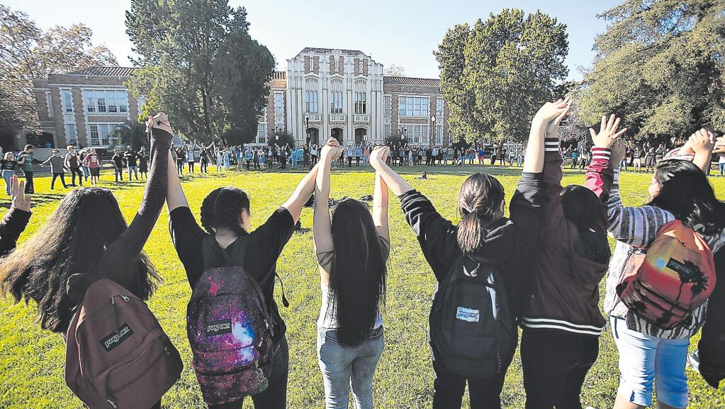 About 200 Santa Rosa High School students walked out of their classes, Monday Nov. 14, 2016 in response to president elect Donald Trump's upcoming four year term and his policies. (Kent Porter / The Press Democrat) 2016