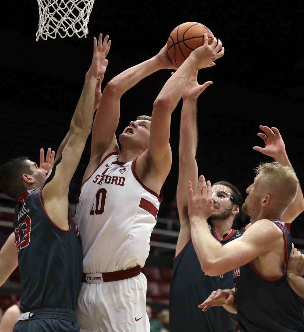 Stanford's Michael Humphrey (10) shoots against Eastern Washington's Luka Vulikic, left, and other players during the first half of an NCAA college basketball game Tuesday, Nov. 14, 2017, in Stanford, Calif. (AP Photo/Ben Margot)