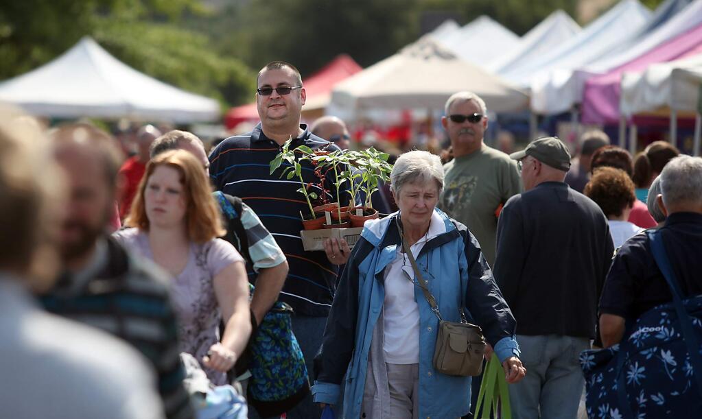 The Santa Rosa Original Certified Farmers Market, founded in 1978 and managed by Pegi Ball, takes place from 8:30 a.m. to noon on Wednesday and from 8:30 a.m. to 1 p.m. on Saturday in the west side parking lot of the Wells Fargo Center for the Arts, 50 Mark West Spring Rd. thesantarosafarmersmarket.com (Kent Porter / Press Democrat) 2012