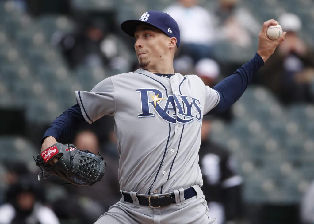 In this April 10, 2018, file photo, Tampa Bay Rays starting pitcher Blake Snell delivers during the third inning against the Chicago White Sox in Chicago. (AP Photo/Jeff Haynes, File)