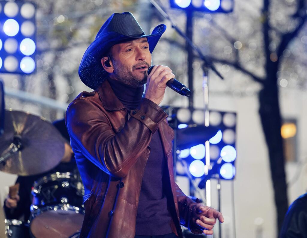 FILE - In this Nov. 17, 2017, file photo, Tim McGraw performs on NBC's 'Today' show at Rockefeller Plaza in New York. McGraw collapsed onstage during a performance in Dublin, Ireland, Sunday, March 11, 2018, the Rolling Stone reports. (Photo by Charles Sykes/Invision/AP, File)